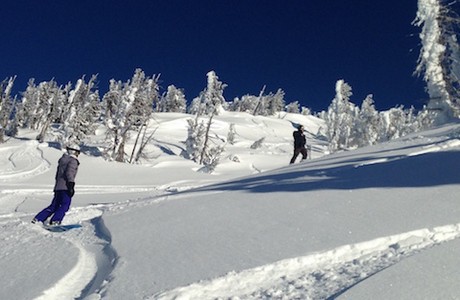 Sandy and Cody Kohlmoos rip the backside of Mt. Bachelor